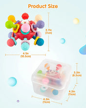 Red sensory teething ball rattle toy with visible size labels in inches