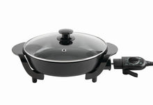 Black electric skillet with stainless lid and removable temperature control on side