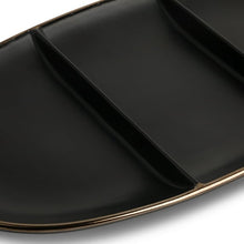 Close-up of divided black stoneware platter with gold-trimmed edge
