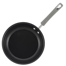 Black nonstick skillet with gray handle and smooth dark interior cooking surface