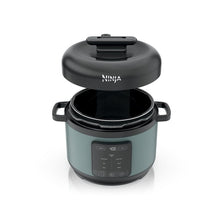 Ninja pressure cooker with open lid, sage green body, black inner pot and base