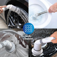 Cordless spin scrubber scrubbing a toilet bowl with rotating round brush head