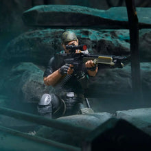 G.I. Joe Tunnel Rat action figure crouched aiming a rifle with scope