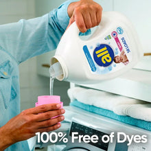 Baby liquid laundry detergent bottle pouring, white with pink cap