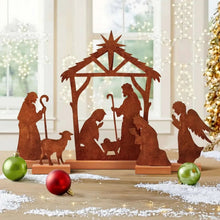 Rusty metal nativity scene tabletop decoration with stable, Mary, baby Jesus and shepherds