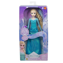Boxed Disney Frozen singing Elsa doll in teal-blue sparkly dress, retail package