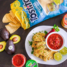 Salsa serving platter with tortilla chips, nachos, red salsa cups, and lime