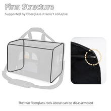 Black pet carrier with rigid support frame and front mesh window view