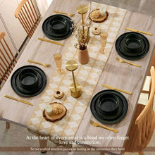 Ceramic dinnerware set with dark green plates and bowls, glossy black rims
