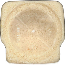 Close-up of white rice filling inside a clear jar