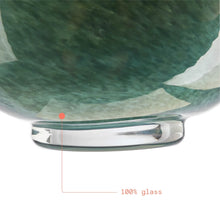 Green mottled glass vase base with thick clear glass foot