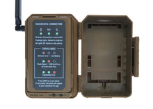 Camouflage cellular trail camera with open door showing LCD status and sensor bay