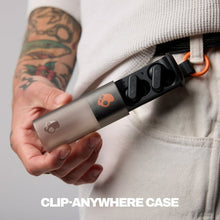 Skullcandy Dime EVO XT clip-anywhere case clipped to clothing with earbuds
