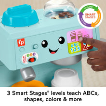 Teal electronic coffee toy with smiling face, ABC123 panel, and Smart Stages buttons