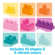 Colorful plastic building blocks in pink, orange, purple, and teal