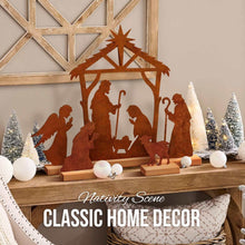 Rusty metal nativity stable tabletop decoration with Mary, baby Jesus, shepherds and angels