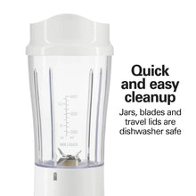 White personal blender jar with measurement markings and visible blades at the bottom