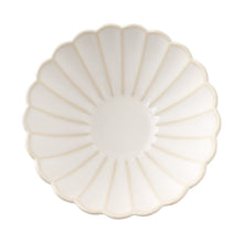 Cream stoneware cereal bowl top view with round center and fluted petals
