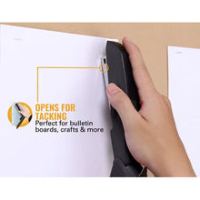 Black stapler used to tack paper, open nose and hand grip visible