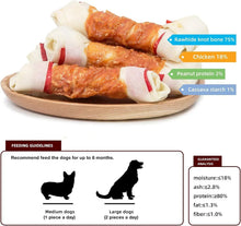 Stacked chicken wrap knotted bone dog chews on a wood slice, white twists and orange center