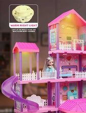 Pink dollhouse playset with warm night light glowing in the rooms