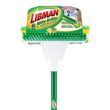 Sponge mop with scrub brush featuring green handle and yellow foam cleaning pad.