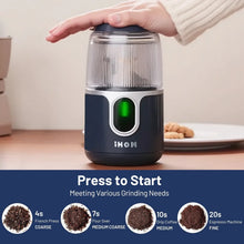 Cordless electric coffee grinder with blue base and transparent lid, green LED display