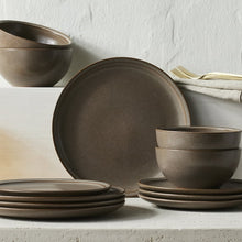 Brown stoneware plates and bowls with speckled glaze