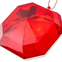 Close-up of red faceted square gem ornament surface with hanging loop
