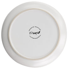 Underside of matt white stoneware salad plate with gold rim and stamp