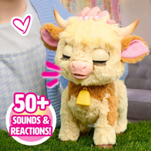 Fuzzy plush cow with closed eyes, pink inner ears, and yellow nose bell
