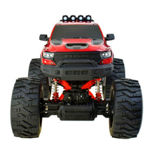 Red RC monster truck rear view with exposed suspension and large tread tires