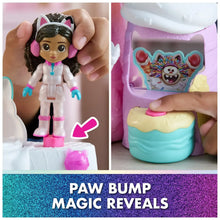 Cat-eared collectible figure and close-up of reveal compartment with colorful paw-themed design