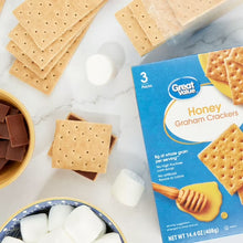 Honey graham crackers with marshmallows, shown with 3-pack box beside crackers