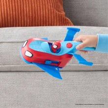 Red and blue Spidey racer vehicle on couch being steered with blue launch arm