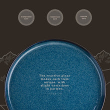 Blue reactive glaze ceramic dinner plate with speckled textured surface