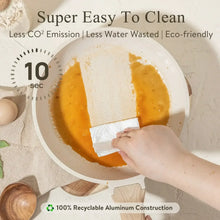 White granite nonstick skillet with paper wipe cleaning, wooden handle visible