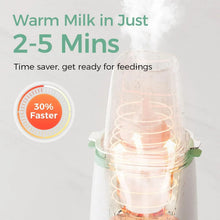 Bottle warmer warming milk, with visible steam rising
