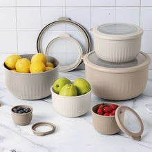 Off-white ribbed mixing bowl set with matching lids, assorted sizes