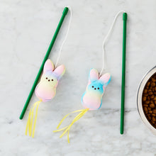 Two cat wand toys with pastel plush bunny heads, green sticks, and yellow ribbon streamers