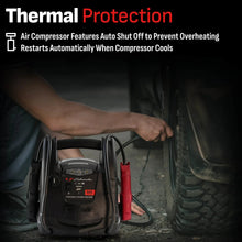 Portable power station with air compressor hose and nozzle near a tire