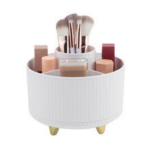 White rotating beauty organizer with makeup brushes and five compartments