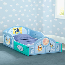 Toddler bed with guardrails, blue and teal frame with blue mattress and character side cutouts
