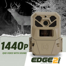 Beige cellular trail camera front view with lens window and rugged housing.