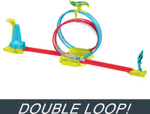 Tri-colored Hot Wheels track set with double loop, green base and red rails