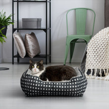 Plush pet bed with black-and-white diamond outer fabric and gray padded inner liner