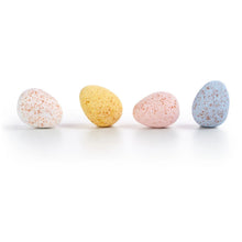 Assorted pastel milk chocolate mini eggs with speckled shells