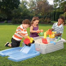 Digger sandbox playset outdoors with blue ramp, gray base, children digging