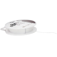 Clear stretch cord spool with loose white cord strand