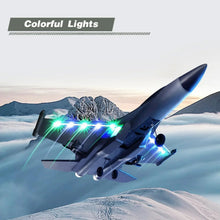 Grey RC jet aircraft with colorful LED lights glowing on nose and wings